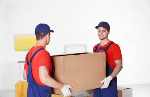 Removal team loading household furniture for a Belmont move