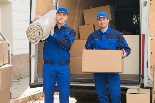 Furniture pickup team helping with bulky sofa removal in Belmont