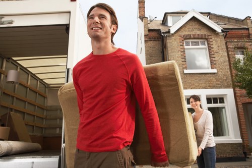 Careful loading of household items into a moving vehicle