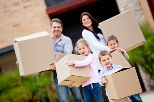 Professional movers handling furniture for a Belmont property