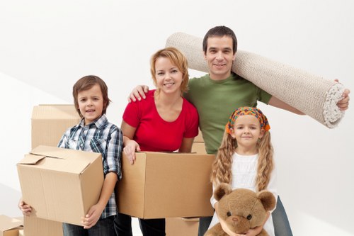 Furniture being carried carefully through a Belmont residential property