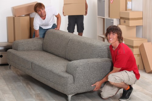 Furniture and boxes prepared for transport on a Belmont moving truck