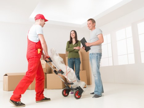 Belmont moving crew unloading furniture and boxes at a new property