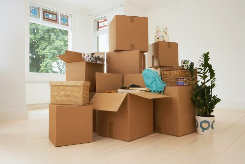 Packed office boxes and furniture ready for relocation